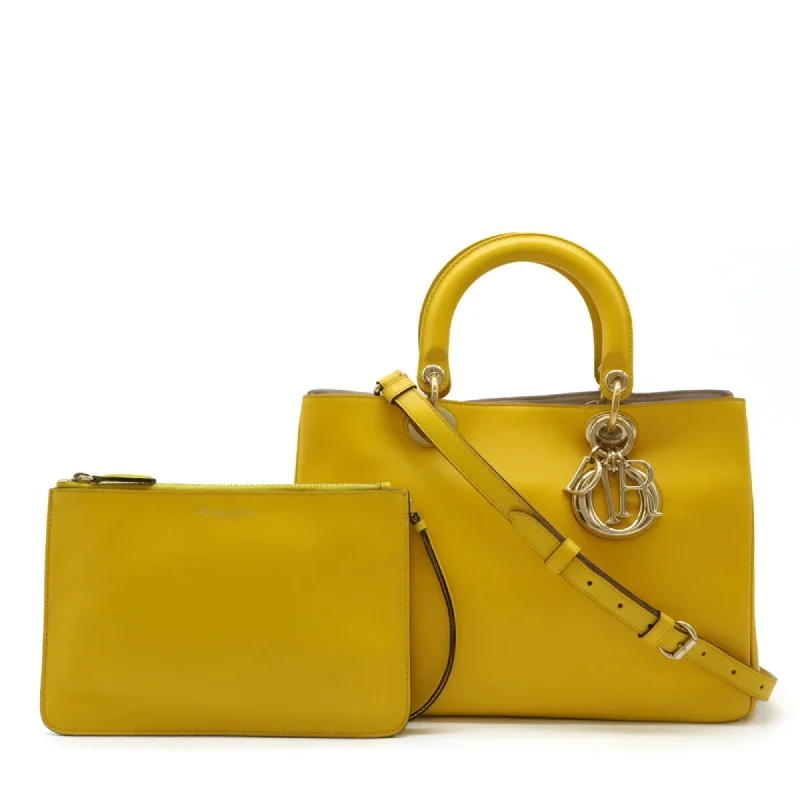 Handle bags with monogram designs for personalization -Christian Dior  yellow Leather Handbag Shoulder Bag Tote Bag (Pre-Owned)