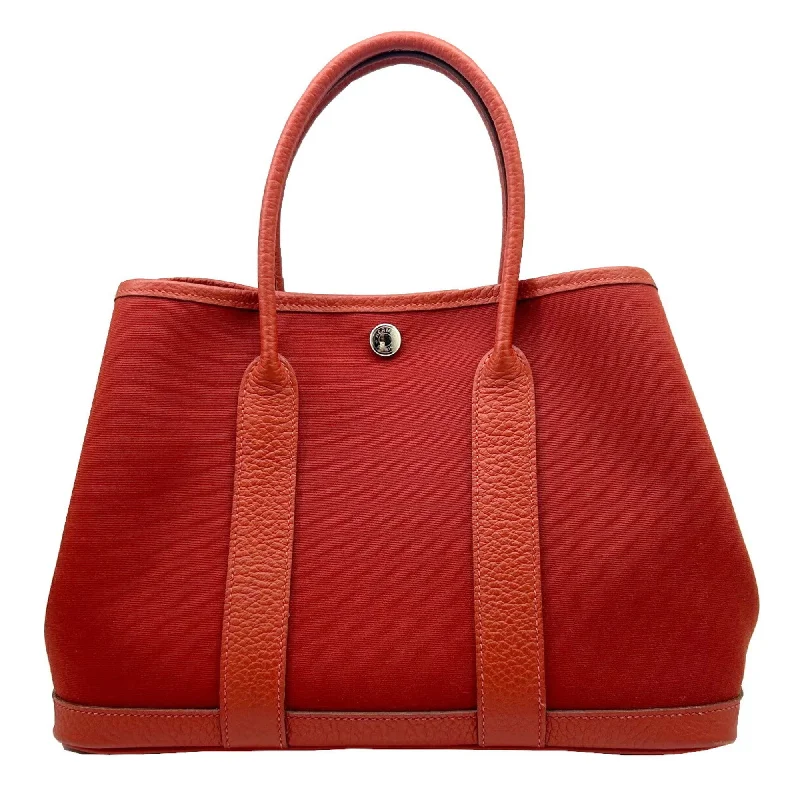 Handle bags with sleek hardware for sophistication -Hermes  Toile H Tote Bag (Pre-Owned)