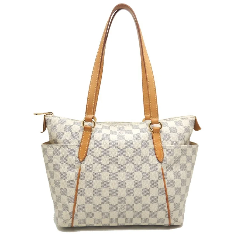 Handle bags with bold checks for trend -Louis Vuitton  Pvc Tote Bag (Pre-Owned)