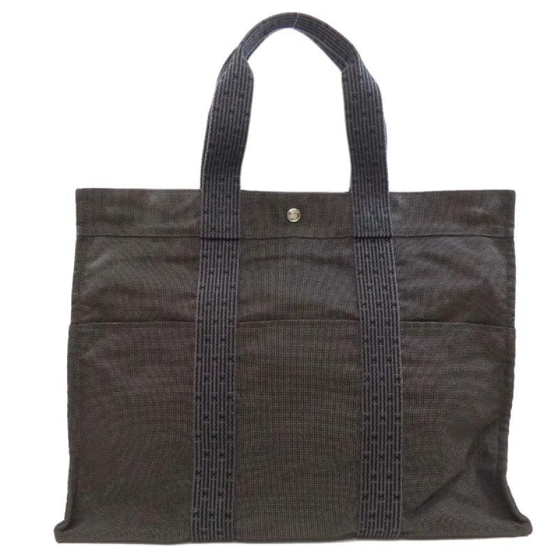 Handle bags with sleek hardware for sophistication -Hermes Her Line  Canvas Tote Bag (Pre-Owned)