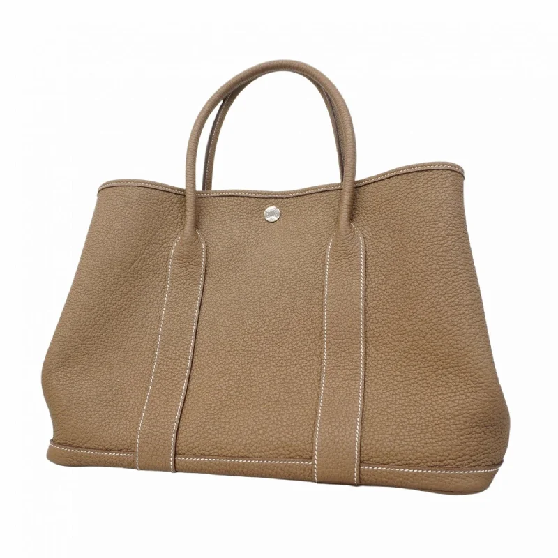 Handle bags with bold stripes for trendiness -Hermes Etoupe  Negonda Leather Tote Bag (Pre-Owned)