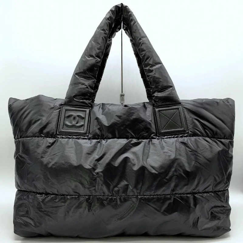 Handle bags with minimalist sleek silhouettes -Chanel  Nylon Handbag Tote Bag (Pre-Owned)