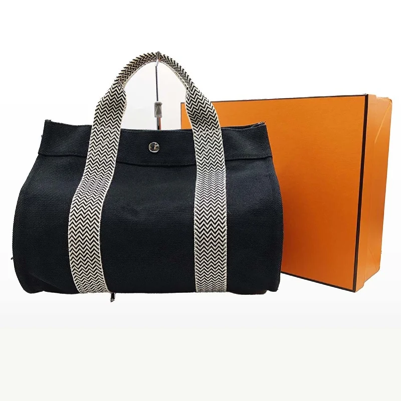 Handle bags with sturdy canvas for longevity -Hermes  Canvas Tote Bag (Pre-Owned)