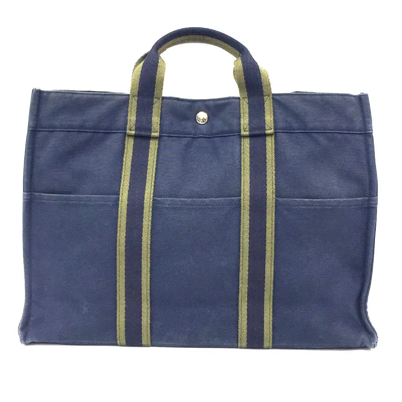 Handle bags with side pockets for organization -Hermes  Canvas Tote Bag (Pre-Owned)