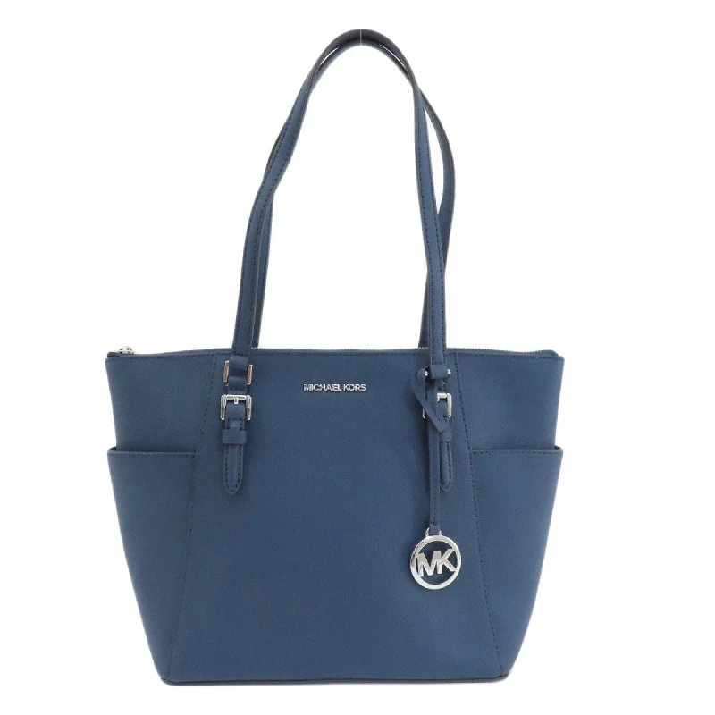 Reversible handle bags offering dual design styles -Michael Kors  Pvc Tote Bag (Pre-Owned)