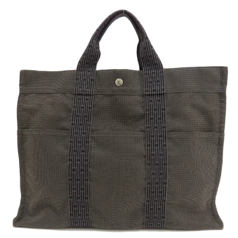 Handle bags with monogram designs for personalization -Hermes  Canvas Tote Bag (Pre-Owned)